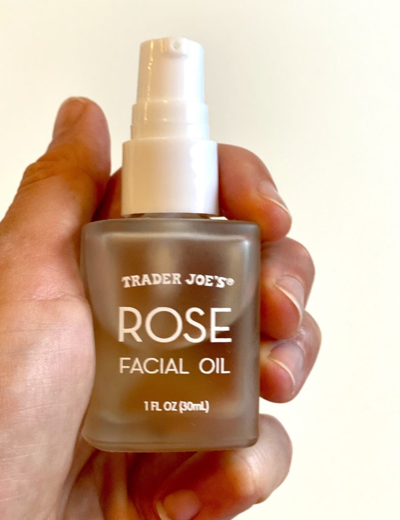 Trader Joe’s Rose Facial Oil with Vitamin C, fruit and vegetable oils, retinol (vitamin A), vitamin E, and naturally-derived oils for moisturizing your skin and conditioning dry hair ends as part of a skincare routine and hair treatment routine