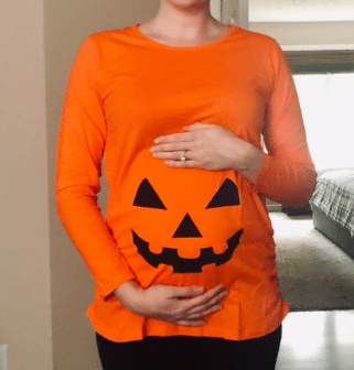 cute pregnant women dressed up as a pumpkin for a maternity easy DIY Halloween costume idea for sale on Amazon