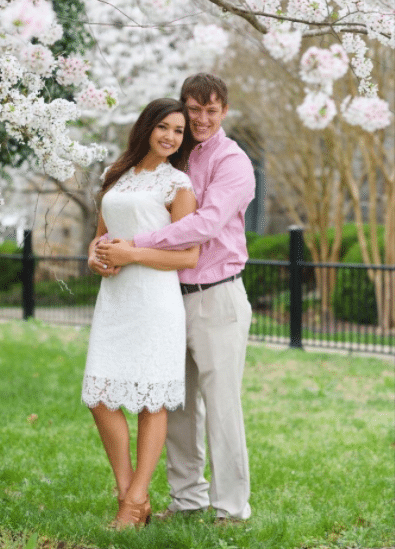 girl wearing white for a spring or fall engagement photo shoot in a white cocktail dress with lace