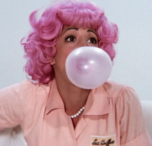 Frenchy from Grease with pink hair for a Halloween costume idea with pink hair