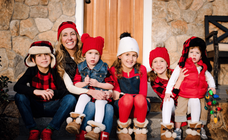 easy family Christmas plaid outfits with hats and boots for Christmas family photos