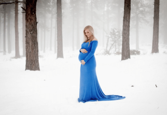 Christmas Maternity Shoot Idea Outside with Blue Dress