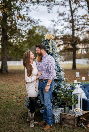 winter and Christmas engagement photo idea outside with Christmas tree