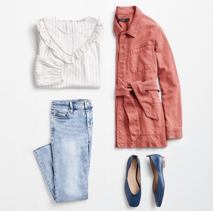 Stitch Fix spring 2022 outfit with white ruffle top, light jeans, blue flats, and red and coral jean cargo jacket