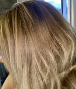 before picture of girl with dark blonde hair before using Sun In Lightening Spray to go blonde