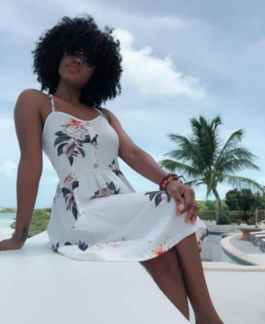 KILIG white summer dress with floral print and buttons on black woman for vacation outfits