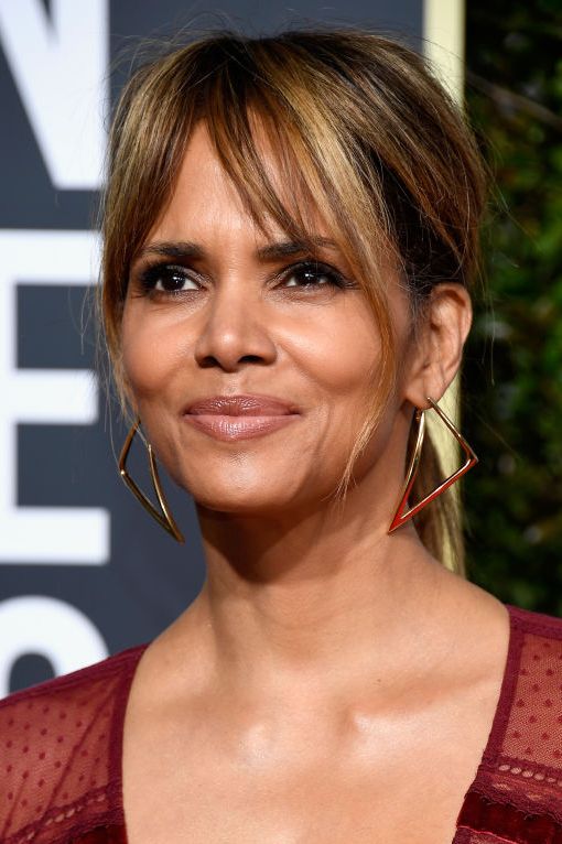 Halle Berry with side bangs and highlights to look younger