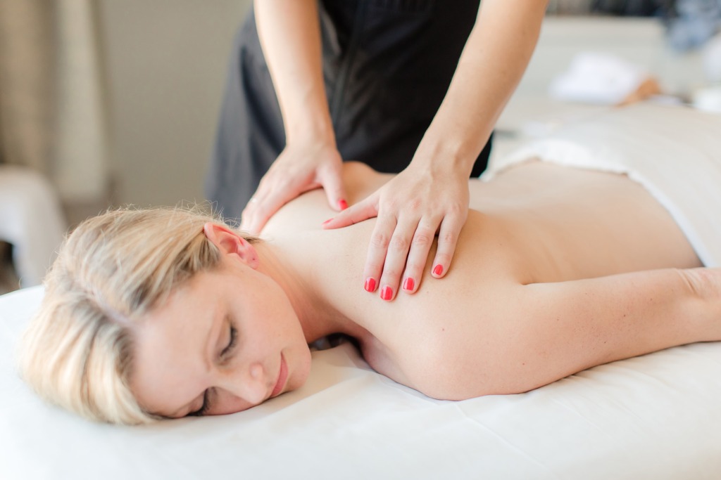 woman in her 40s getting a massage to look younger