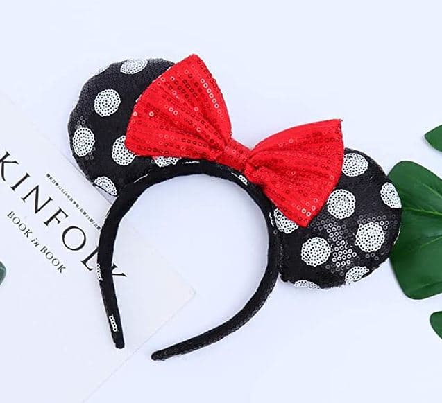 black Minnie Mouse ears with white polka dots and red bow