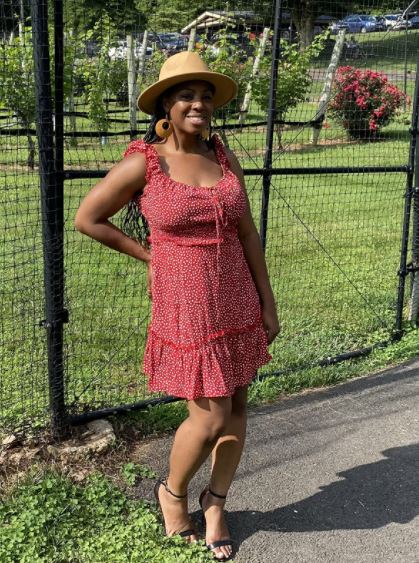 black woman vacation outfit with red polka dots