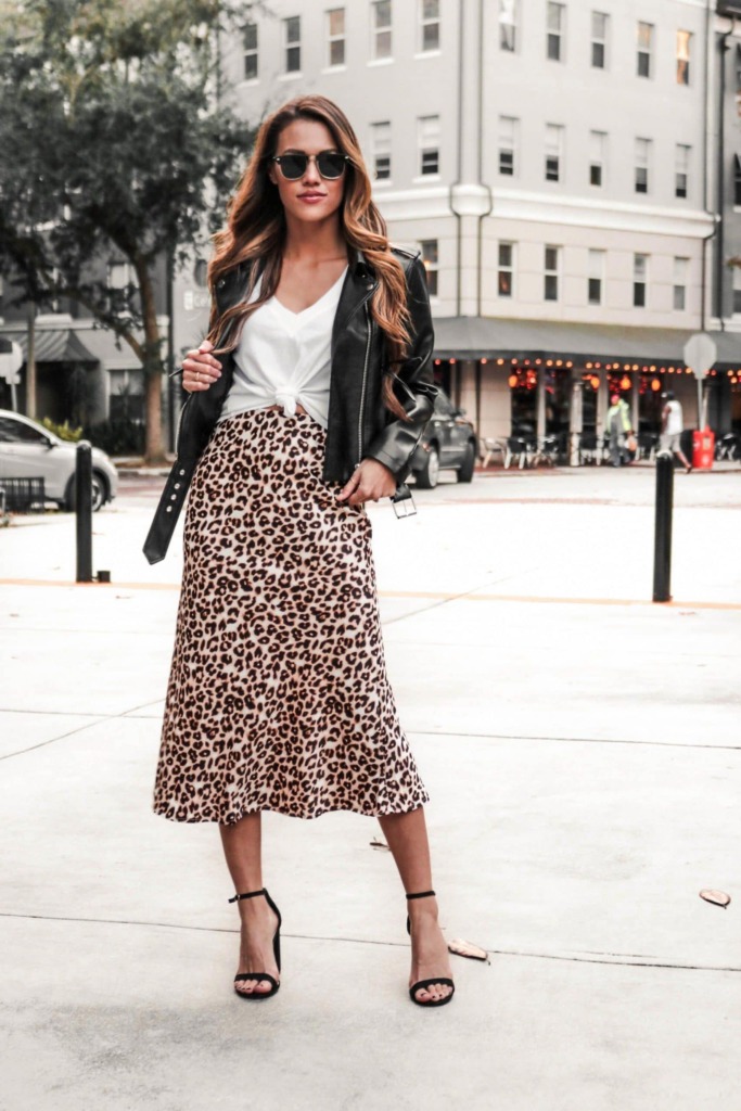 Leopard Print Outfit Idea with midi leopard print skirt, heels, and black jean jacket