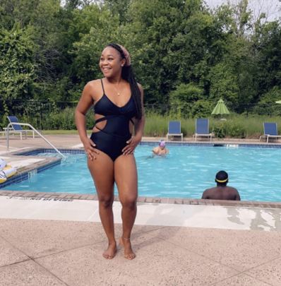 sexy black monokini on black woman at pool