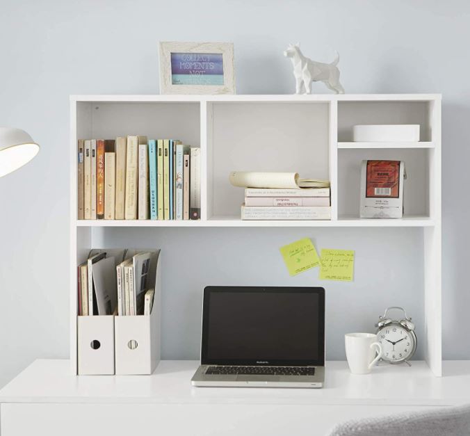 college dorm room decor with bookshelf above desk