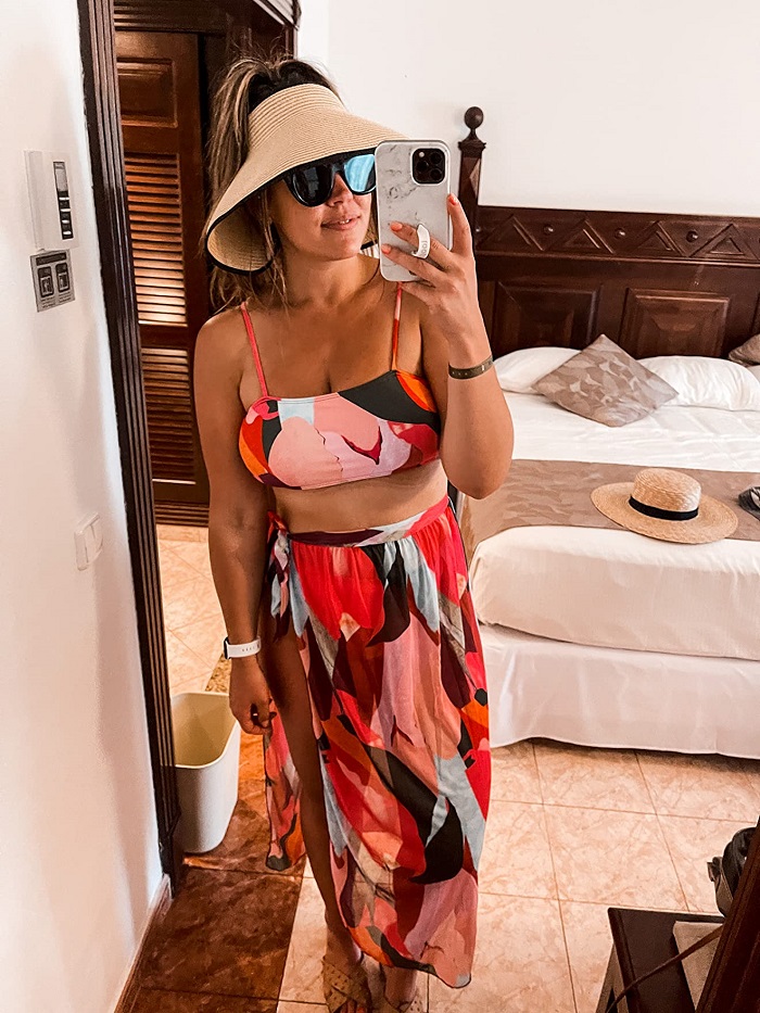 cute two piece beach outfit with hat and floral skirt