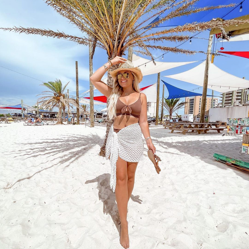 cute outfits for the beach with tan bikini, hat, and sarong