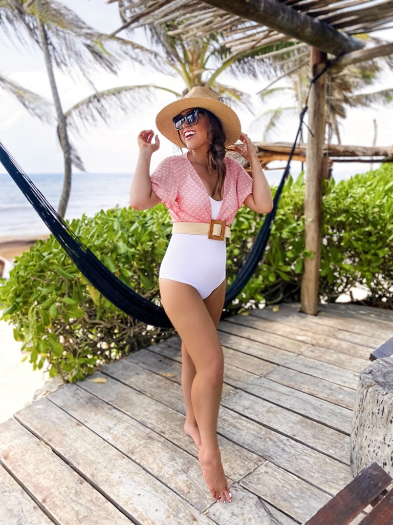 cute beach outfit with white swimsuit, hat, and pink cover up