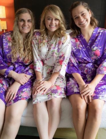 iFigure tropical bridesmaids robes and bride robe for getting ready in dark purple and cream