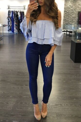 fall date night outfit with off the shoulder ruffle top and skinny blue jeans with heels