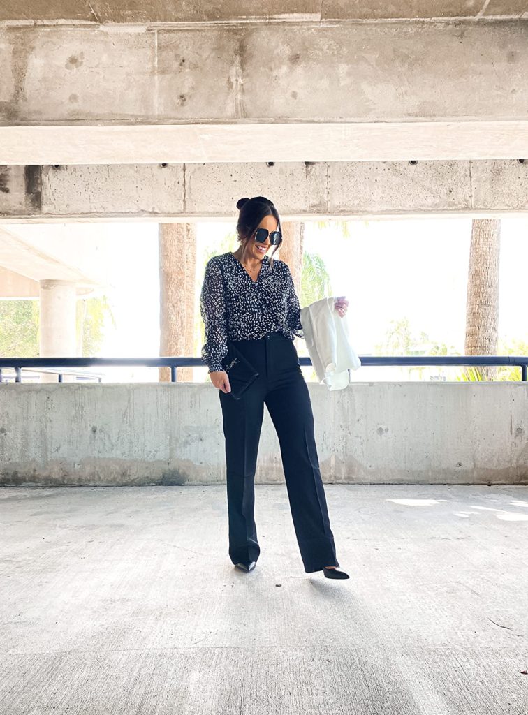 business professional outfit idea with black trouser pants, black and white blouse, and black heels on Amazon