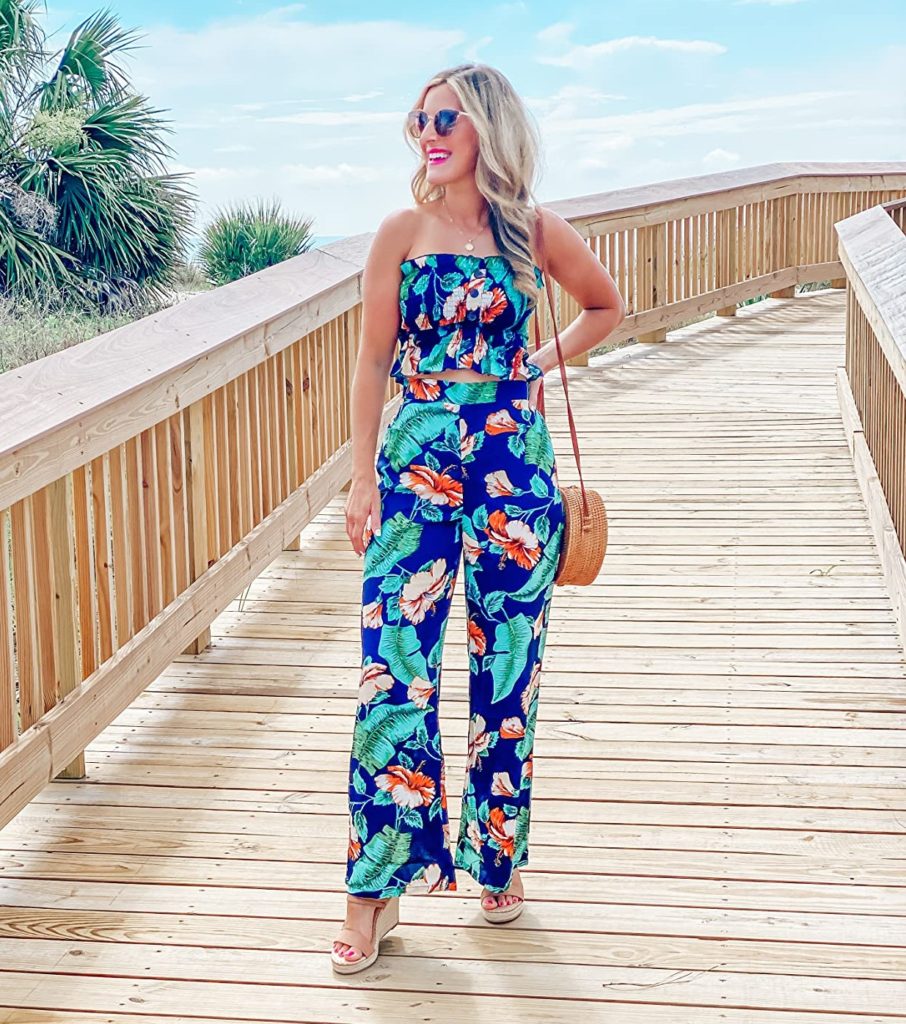 cute two piece summer outfit for women with floral jumper, sandals, and purse
