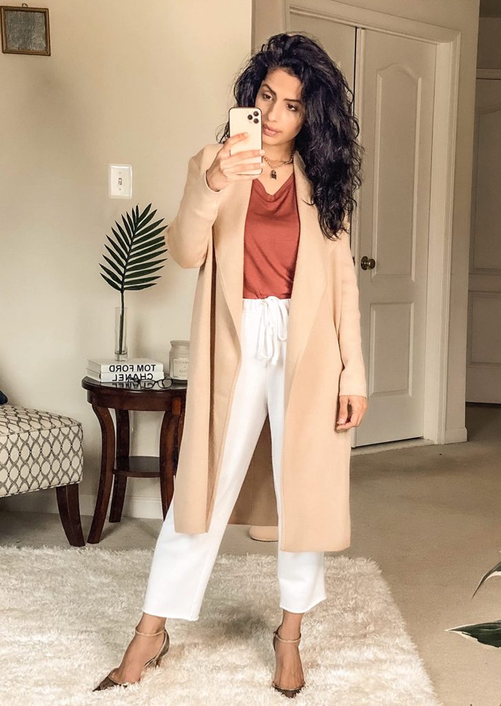 dressy loungewear outfit for women with white pants, tan cardigan, and red shirt