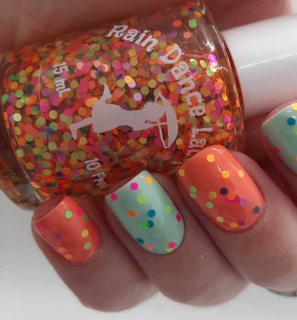 fun and sparkly fall back to school nails with orange and mint light green nails