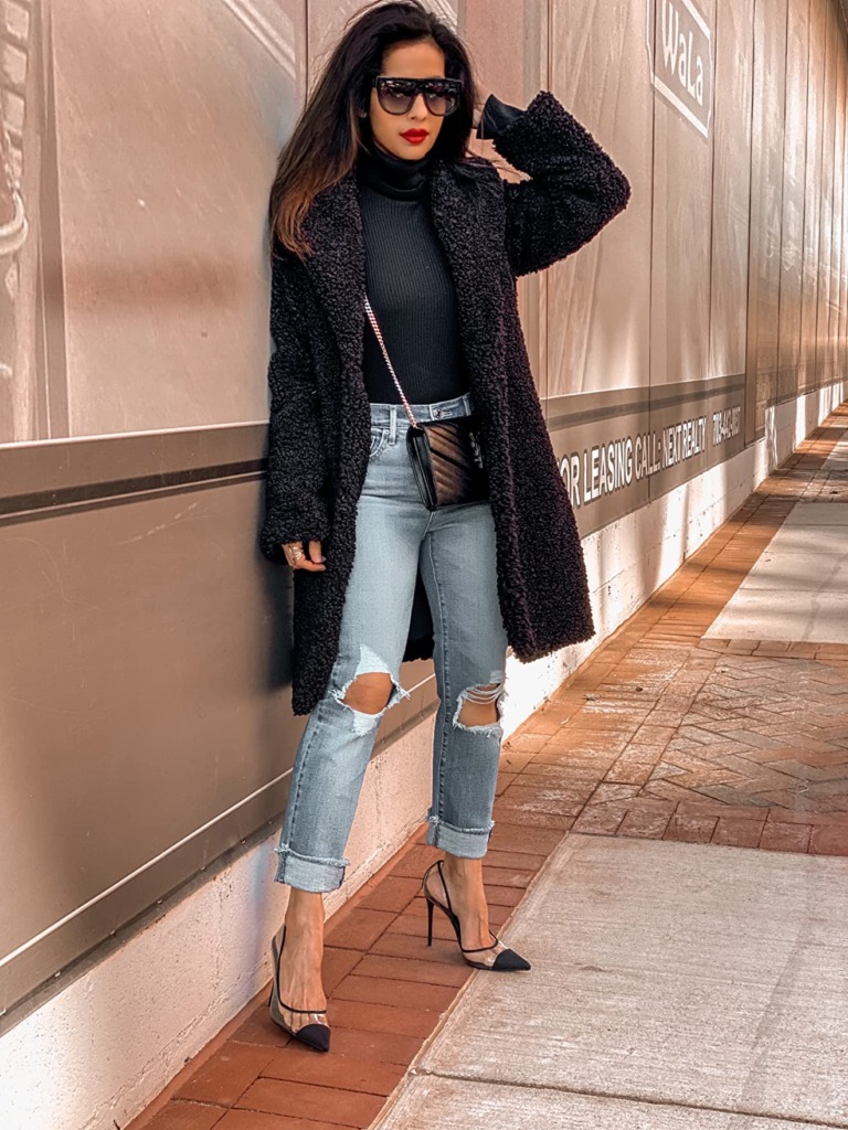 fall outfit idea with ripped jeans, black oversized coat, black turtleneck, black heels, and sunglasses from Amazon