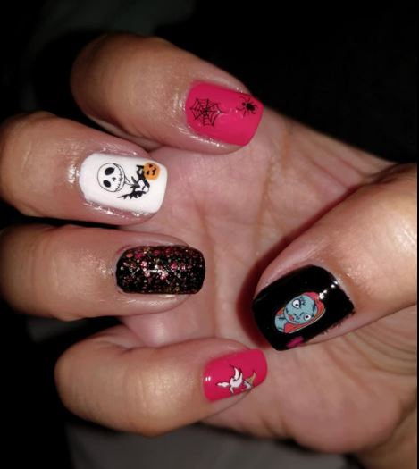 hot pink and black Halloween nails with Jack Skellington Halloween nail stickers