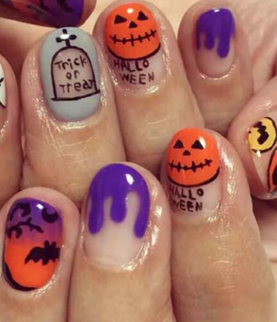 purple and orange Halloween nails with Halloween stickers