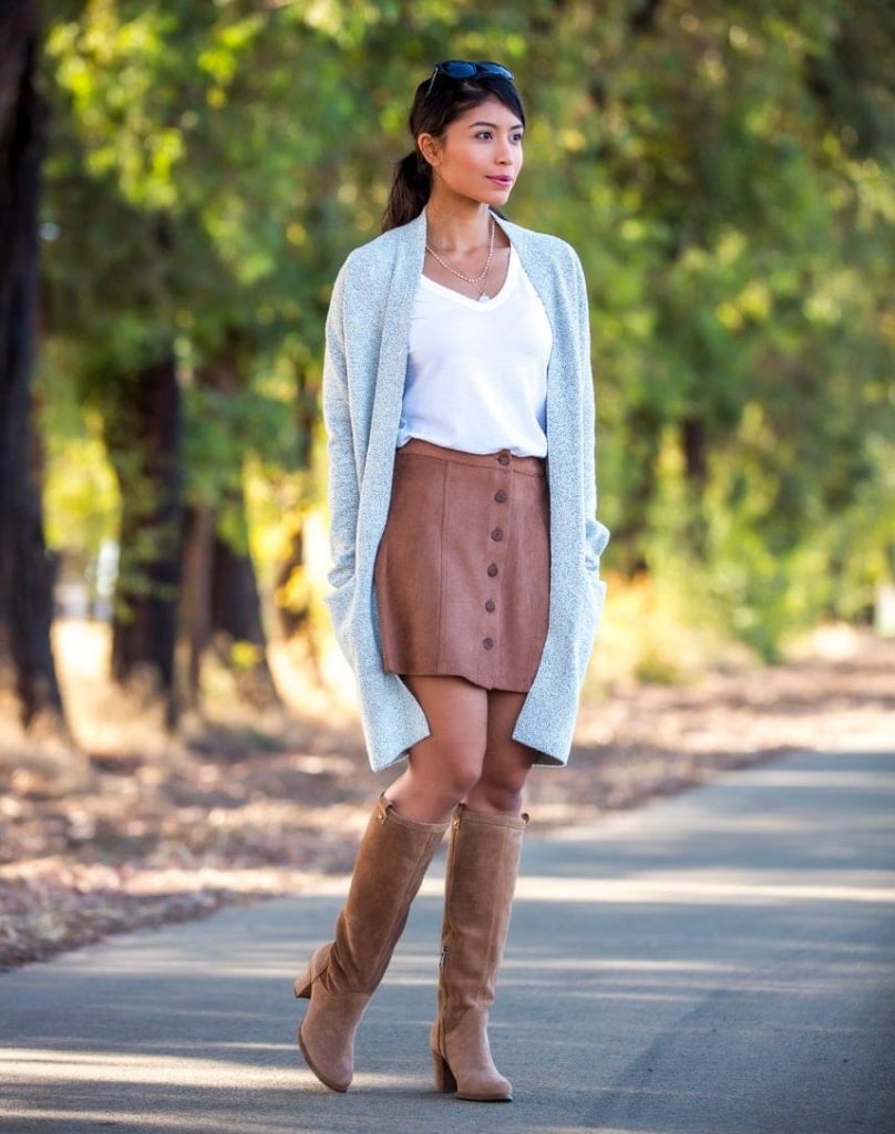 cozy and casual fall outfit with skirt and knee high boots