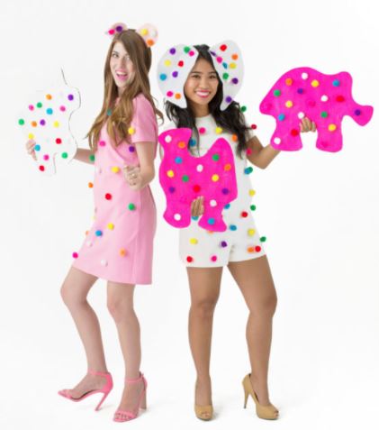 two teenage girls dressed up as cookies and sweets for Halloween