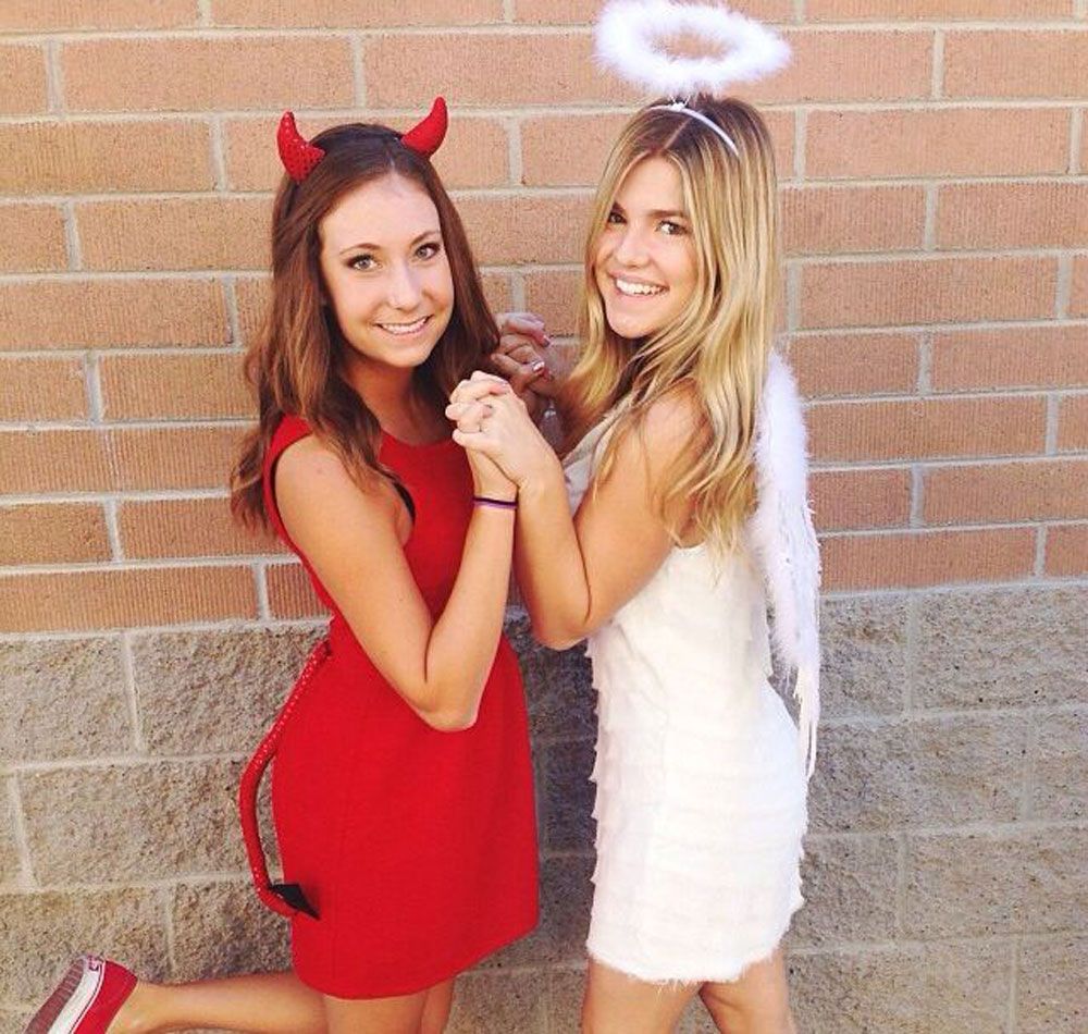 teenage girl best friends dressed up as DIY angel and devil for Halloween