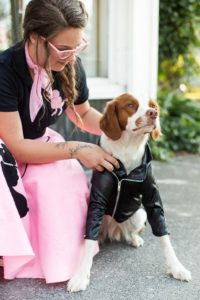Grease and 1960s Halloween costumes for dog and owner