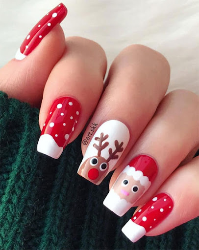 Christmas winter nails with reindeer and Santa Claus