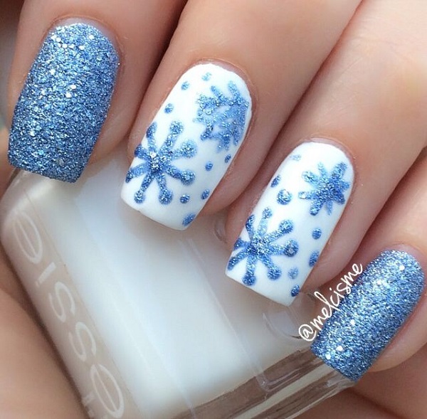 white and light blue winter nail idea with snowflakes