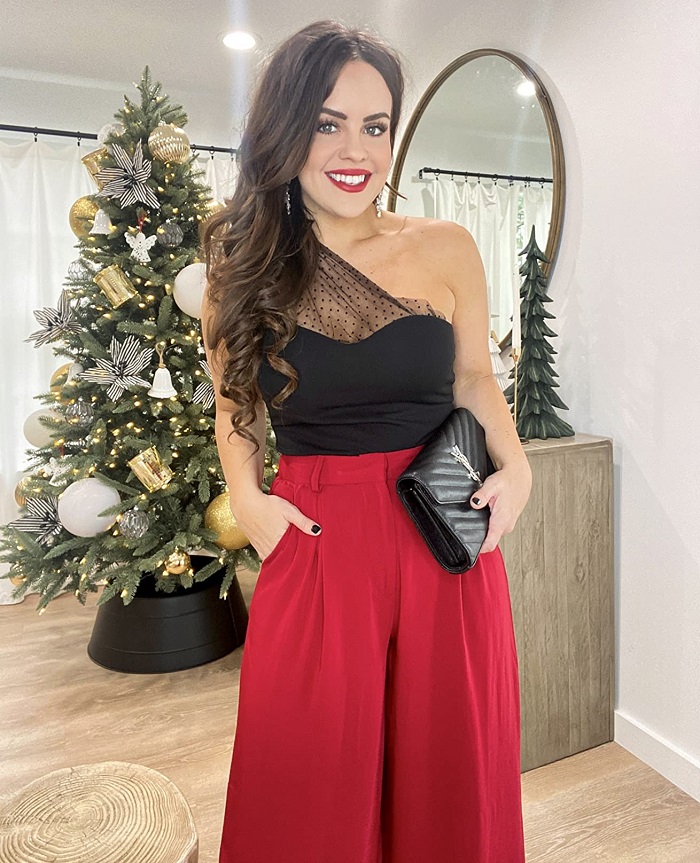 red Christmas party outfit with pants and one shoulder top