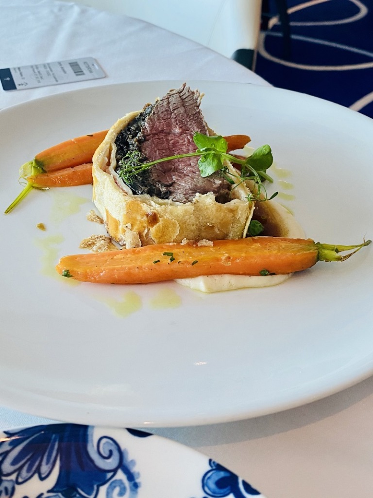 Holland America Rotterdam ship dinner with steak and vegetables