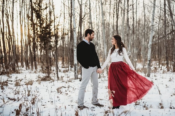 winter engagement photo outfit with red skirt and white blouse