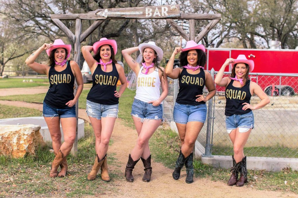 Bride Squad Easy Cowgirl Bachelorette Party Outfits with Pink Cowgirl Hats