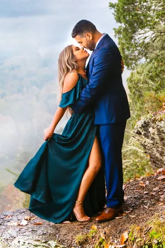 Fall Engagement Photo Shoot Outfit Idea with Blue Dress for Her and Blue Suit for Him