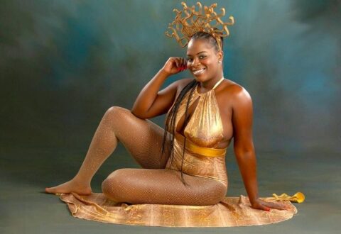 40th Birthday Photoshoot Idea with Gold Medusa Bodysuit on Black Woman