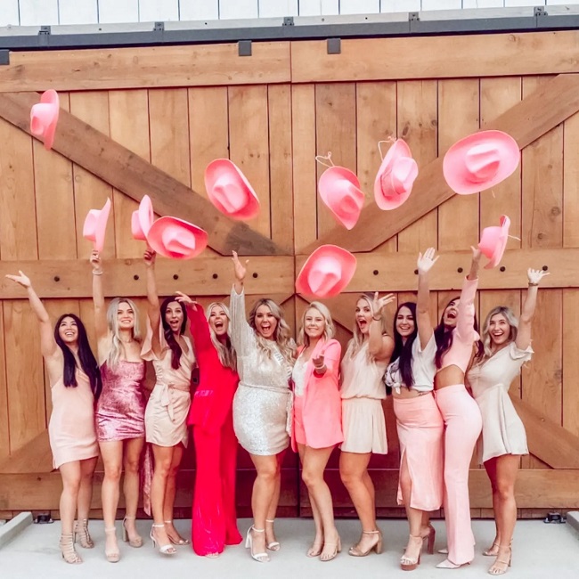 Bachelorette Party Outfit Theme with Pink Cowgirl Hats