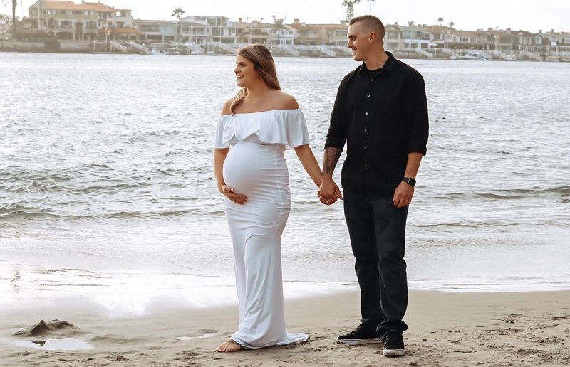 Beach Maternity Couples Photoshoot with White Maternity Dress