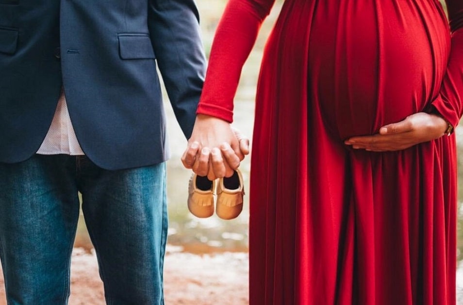 Couple Maternity Photoshoot Idea with Baby Shoes
