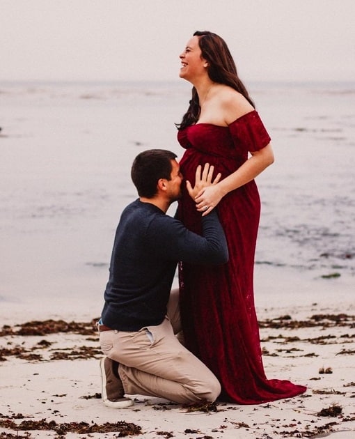 Couple Maternity Photos Kissing Belly