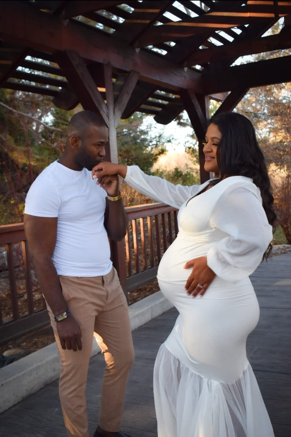 Black Couple Maternity Photoshoot Idea Kissing the Hand