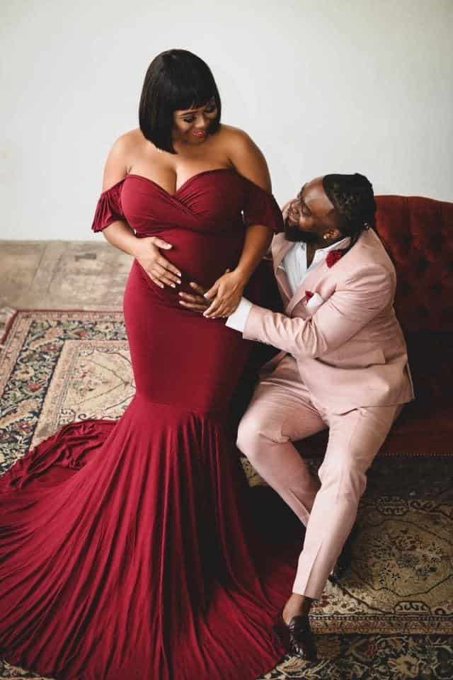 Black Couple Maternity Photos on Couch Inside