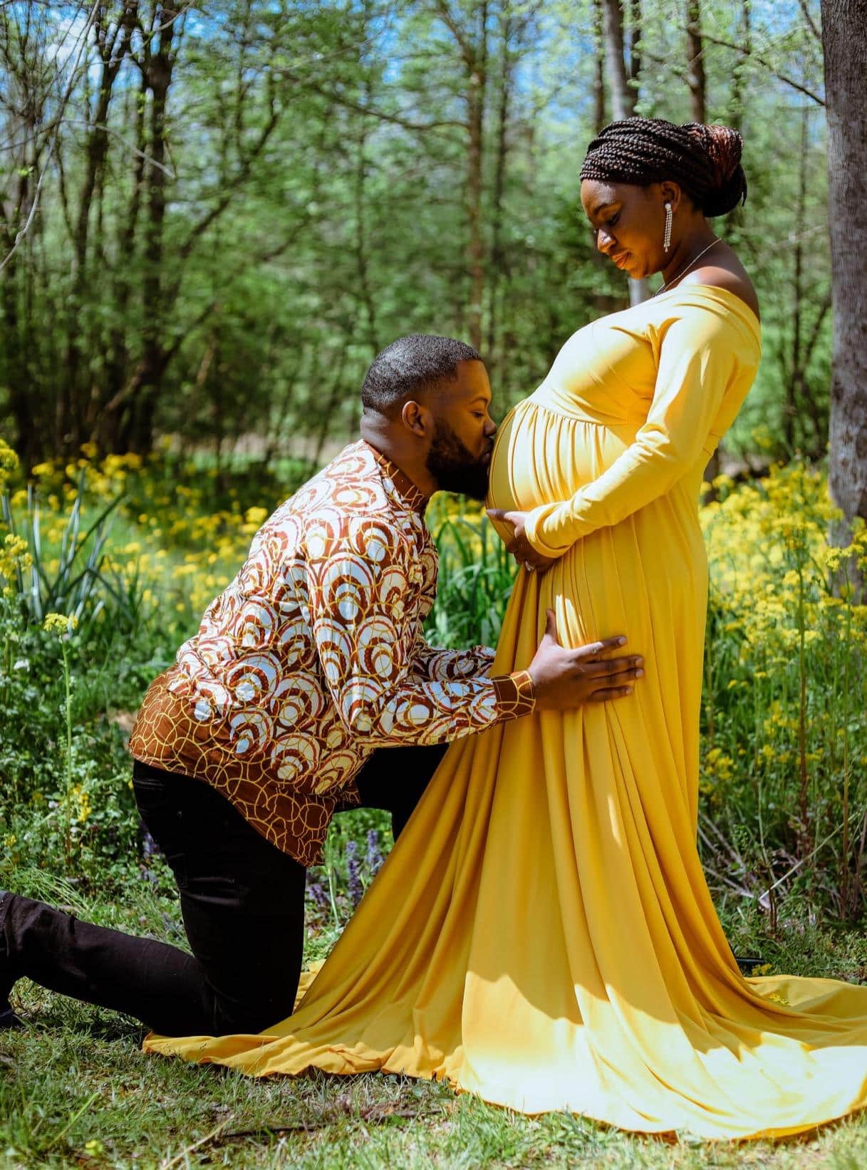 Black Couple Maternity Photoshoot Kissing Belly