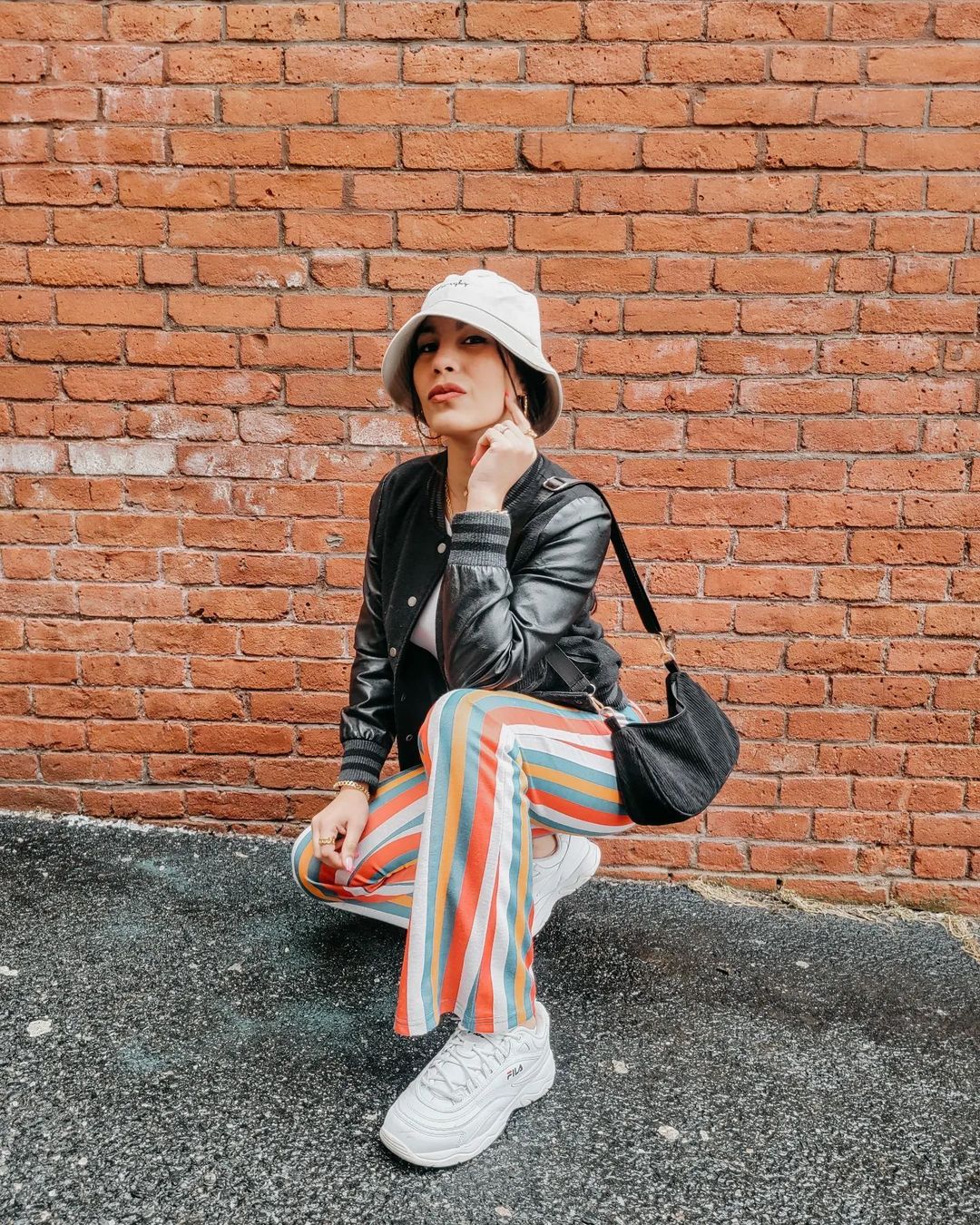 Bucket Hat Outfit with Leather Jacket and Rainbow Pants