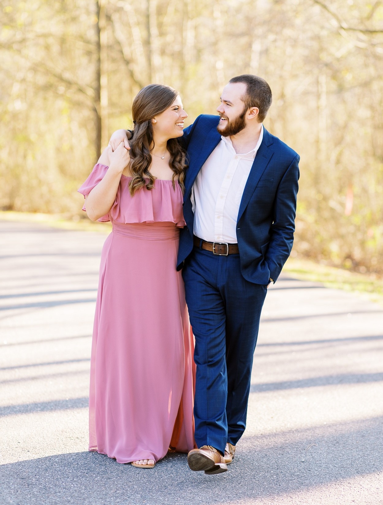 Spring Engagement Photo Outfits with pink dress and blue suit